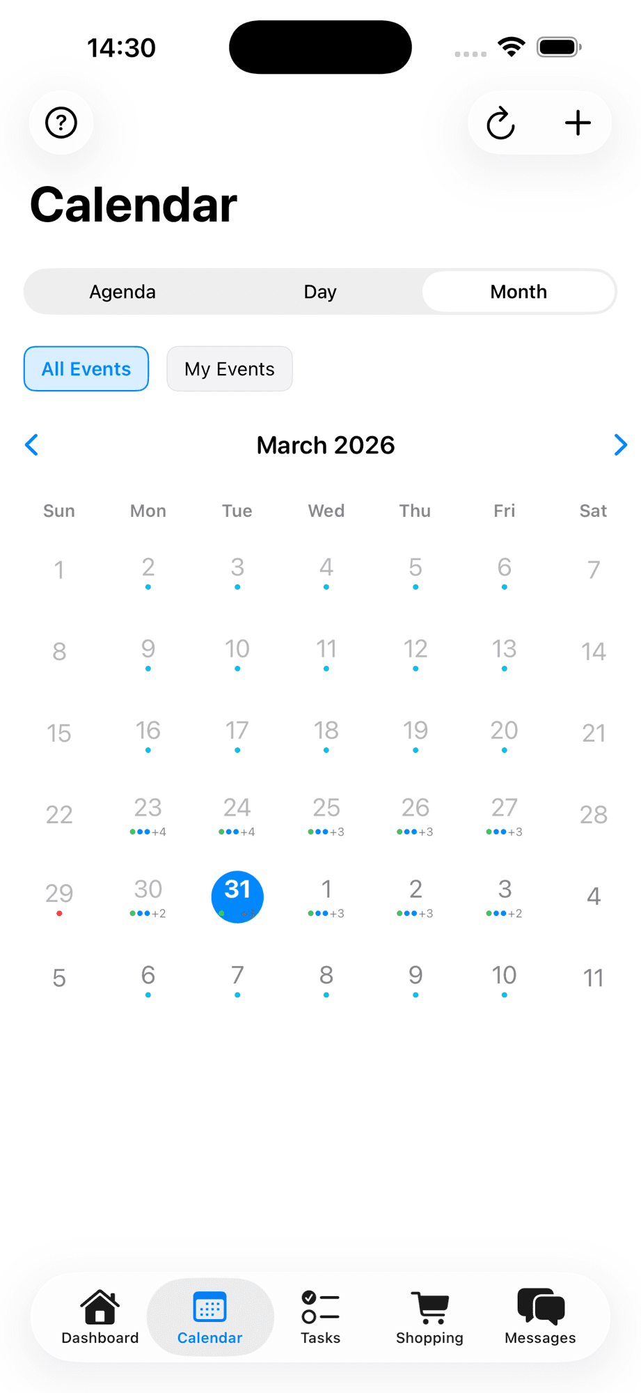 Calendar month view showing March 2026 with color-coded event dots for each day and navigation between months